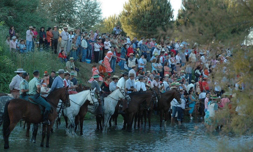 Caballos cruzando el vado del Quema